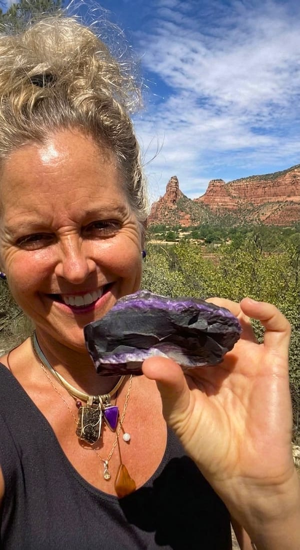 Rita Lorraine Carey holding an amethyst, in Sedona, Arizona
